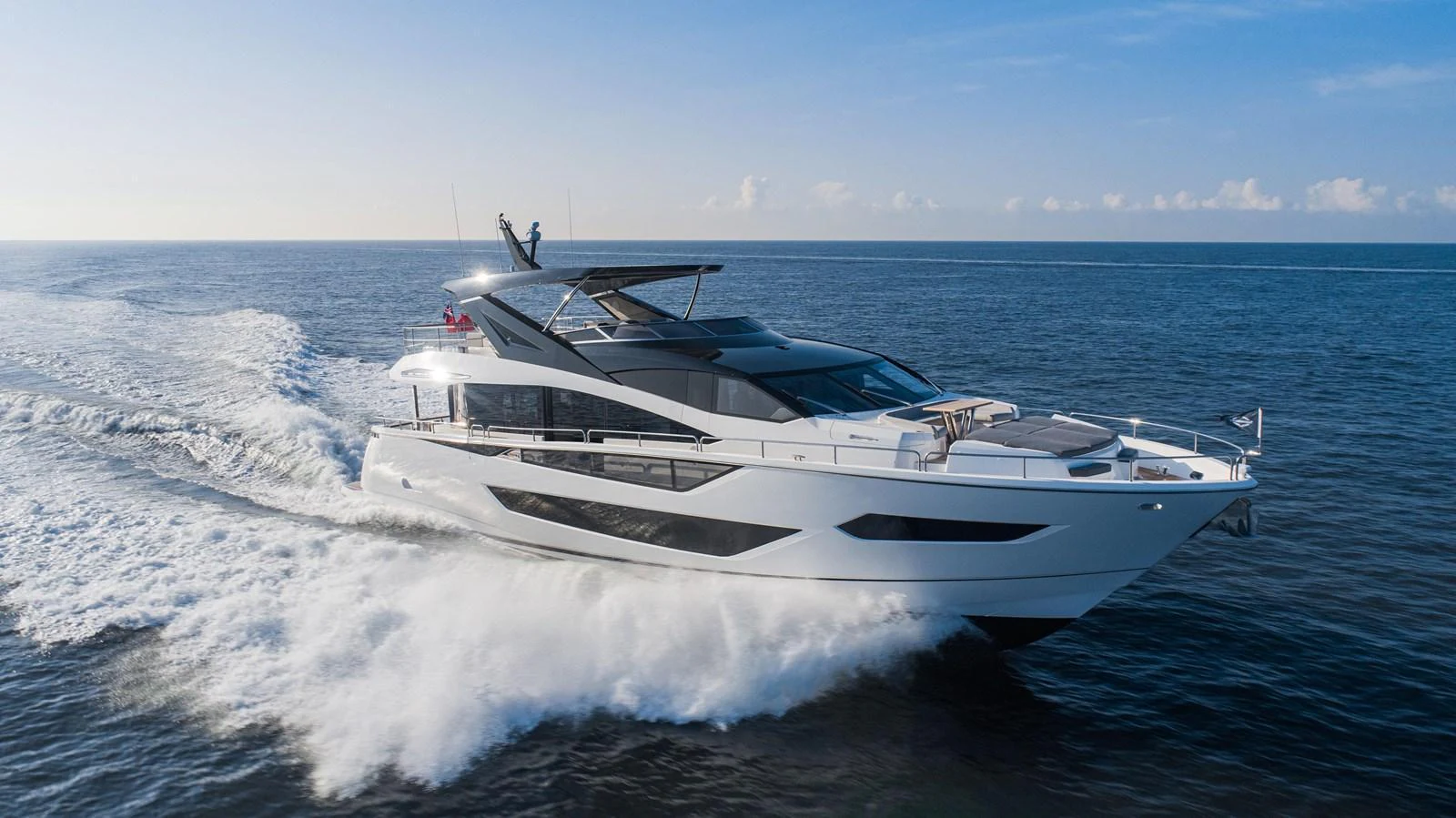 A sleek and modern yacht cruises swiftly through the open sea, showcasing its elegant design and powerful performance. aboard SU Yacht for Sale