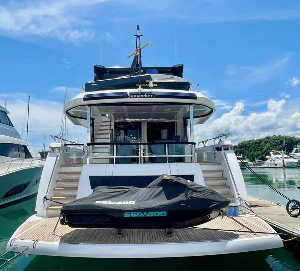 The yacht's aft deck features a spacious layout with a Sea-Doo jet ski docked at the stern. aboard SU Yacht for Sale