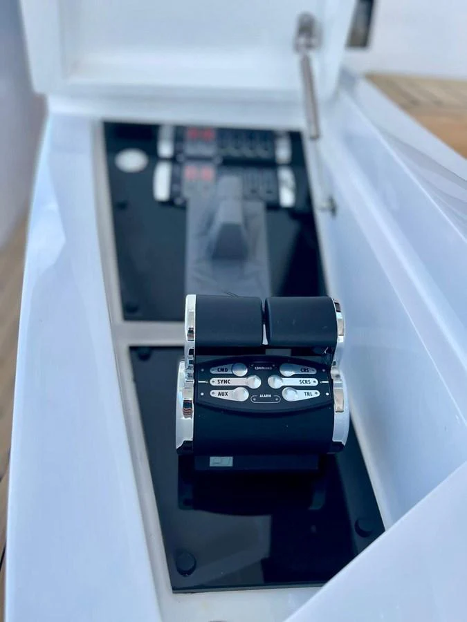 A close-up view of the yacht's throttle controls, showcasing precision engineering. aboard SU Yacht for Sale