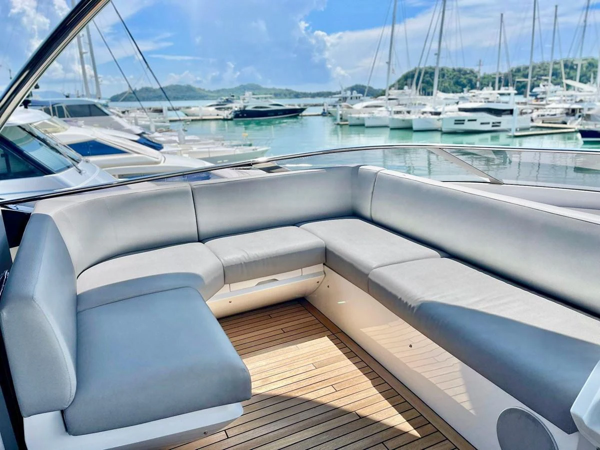 The aft deck features a spacious and comfortable seating area with a stunning marina view. aboard SU Yacht for Sale