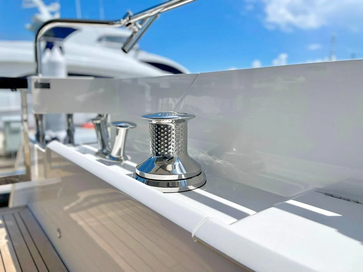 A close-up view of polished stainless steel winches on a yacht's deck, showcasing the high-quality craftsmanship. aboard SU Yacht for Sale