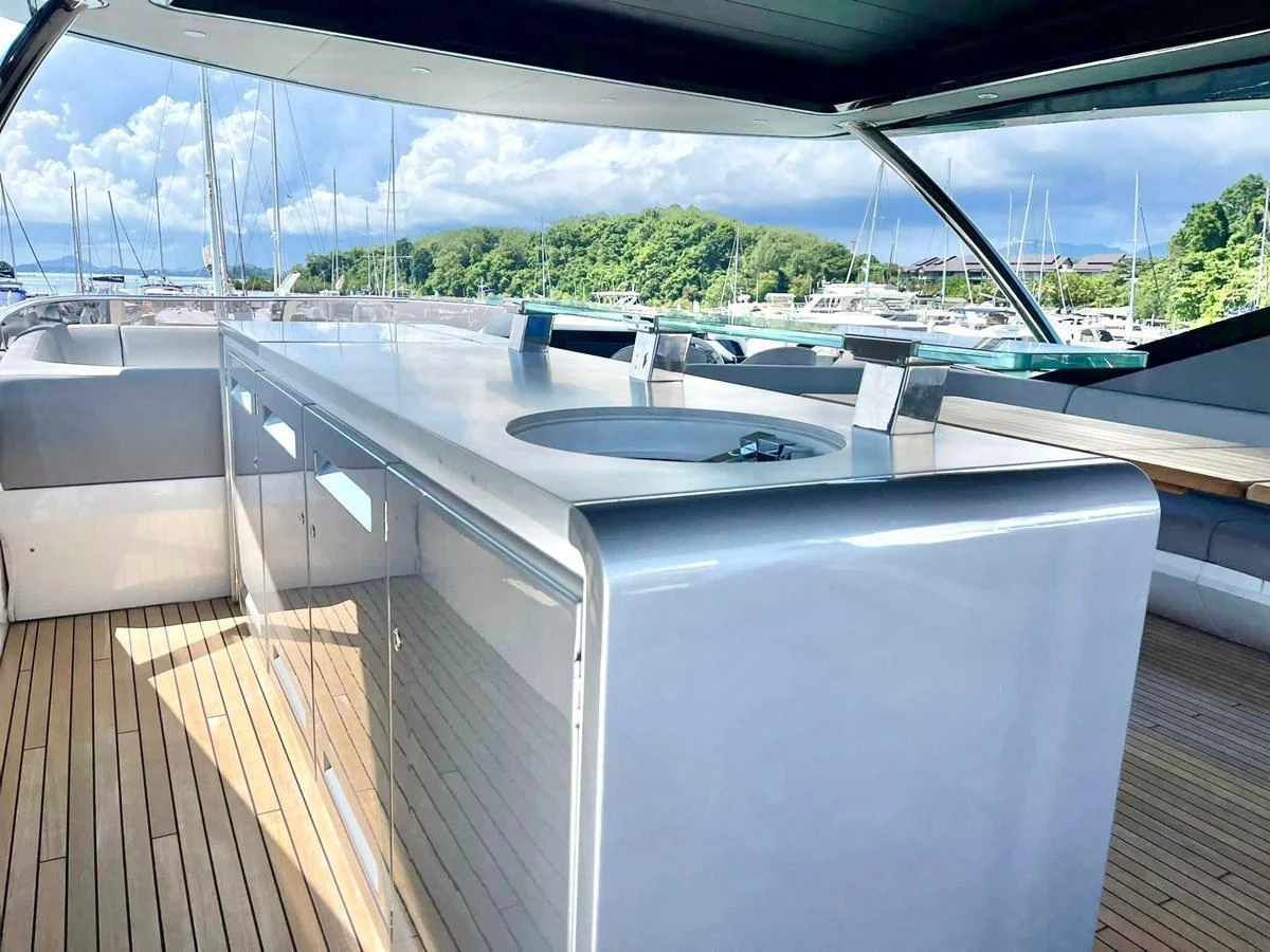 The flybridge features a sleek bar area with modern amenities and stunning views. aboard SU Yacht for Sale