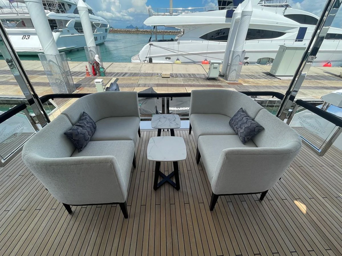 The aft deck features a stylish seating area with plush sofas and elegant tables, perfect for relaxation and socializing. aboard SU Yacht for Sale