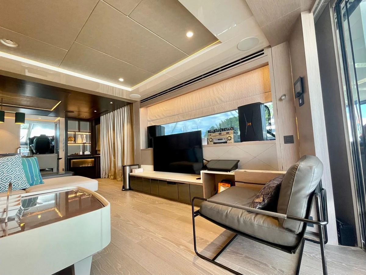 The yacht's interior features a modern and spacious living area with stylish furnishings and ample natural light. aboard SU Yacht for Sale