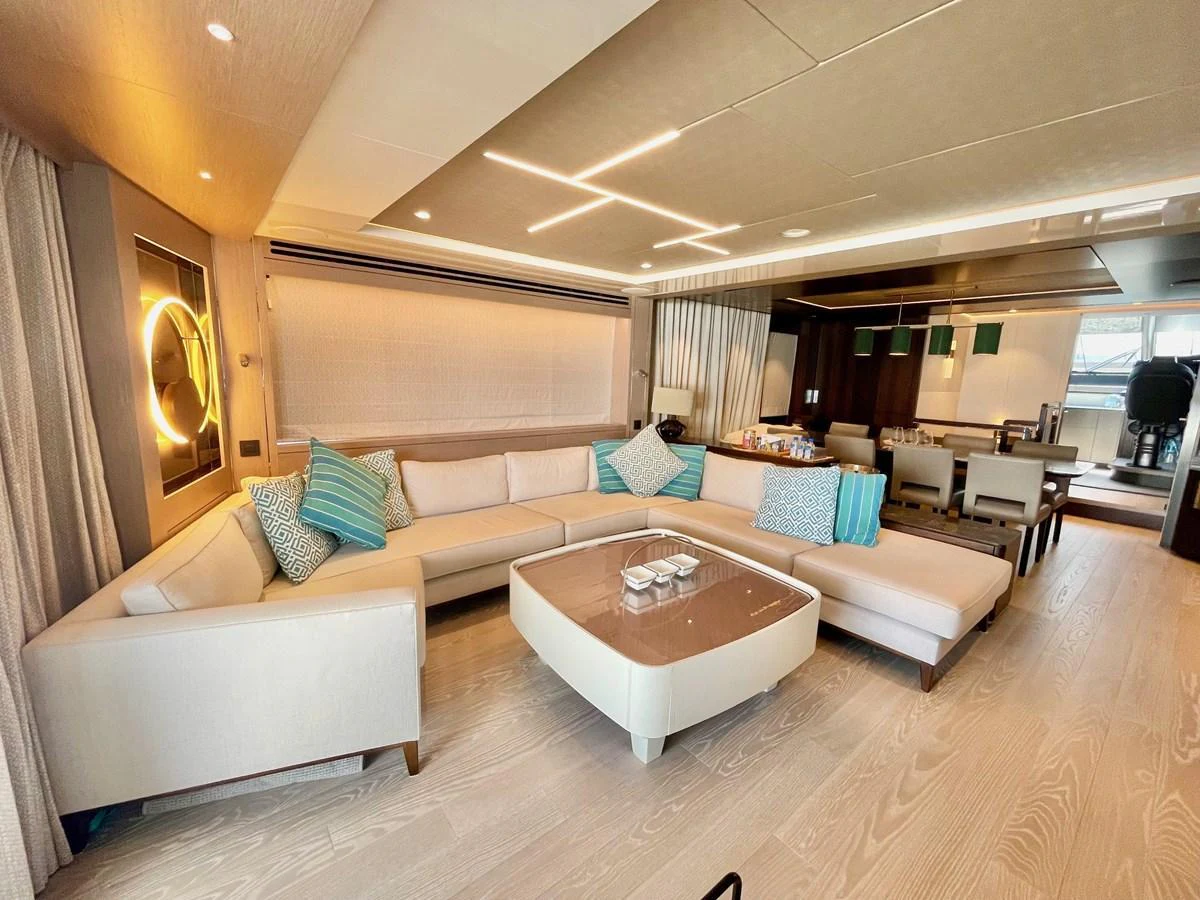 The yacht's salon features a spacious and elegant seating area with modern decor and ample natural light. aboard SU Yacht for Sale