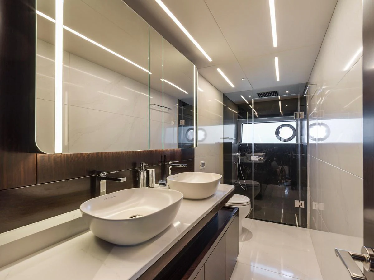 The yacht's bathroom features modern fixtures and a sleek design. aboard SU Yacht for Sale