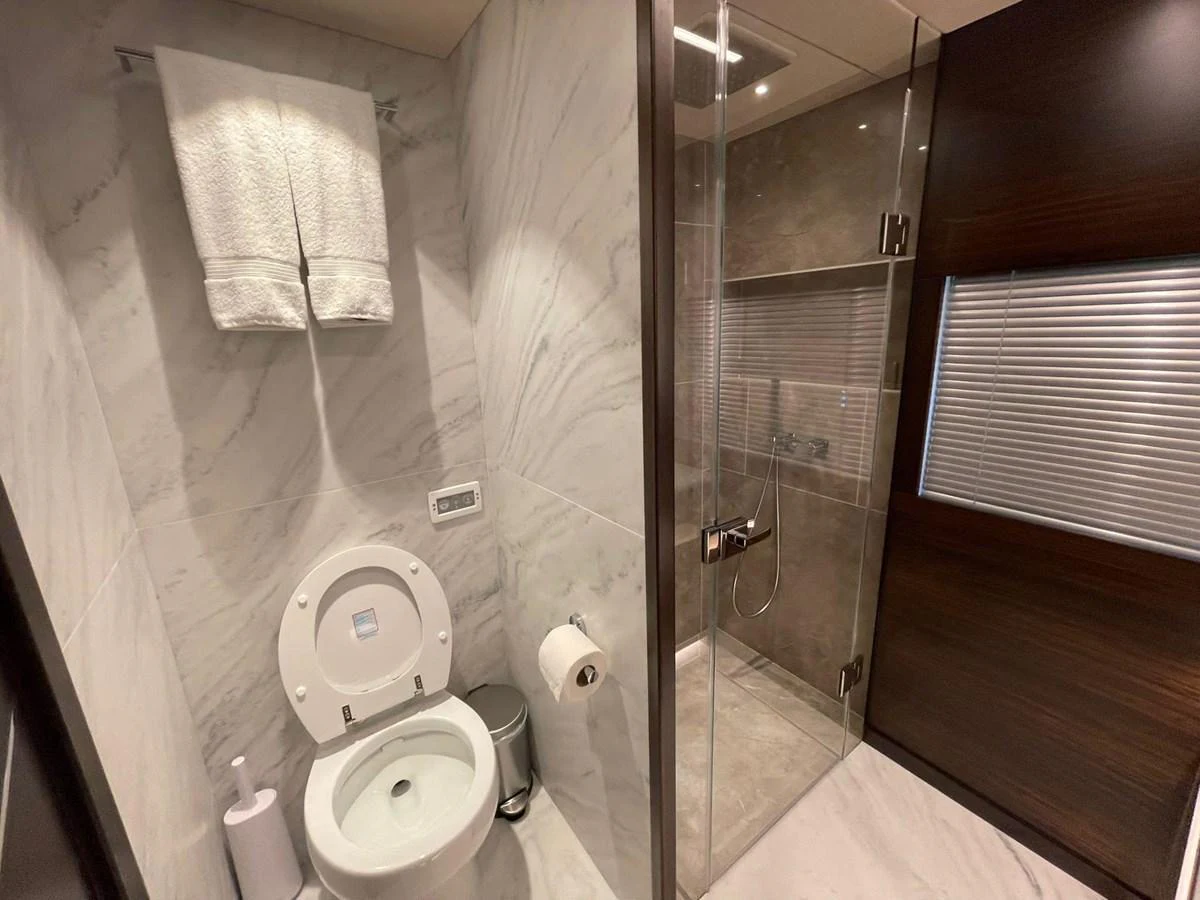 A modern yacht bathroom with a sleek design and luxurious finishes. aboard SU Yacht for Sale