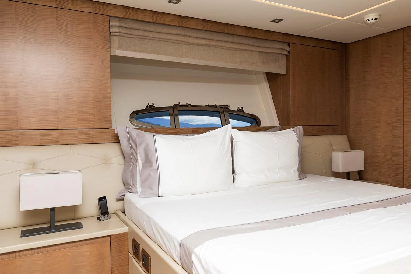a room with a bed and a desk aboard GRACE Yacht for Sale