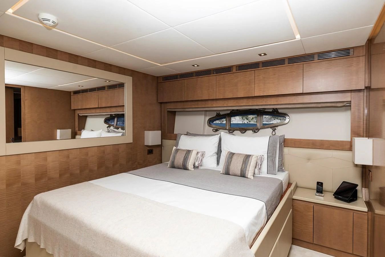 a room with a bed and a desk aboard GRACE Yacht for Sale