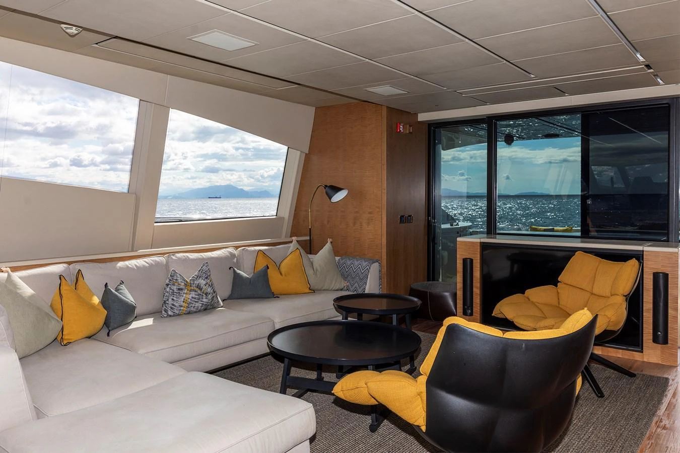 a living room with a large window aboard GRACE Yacht for Sale