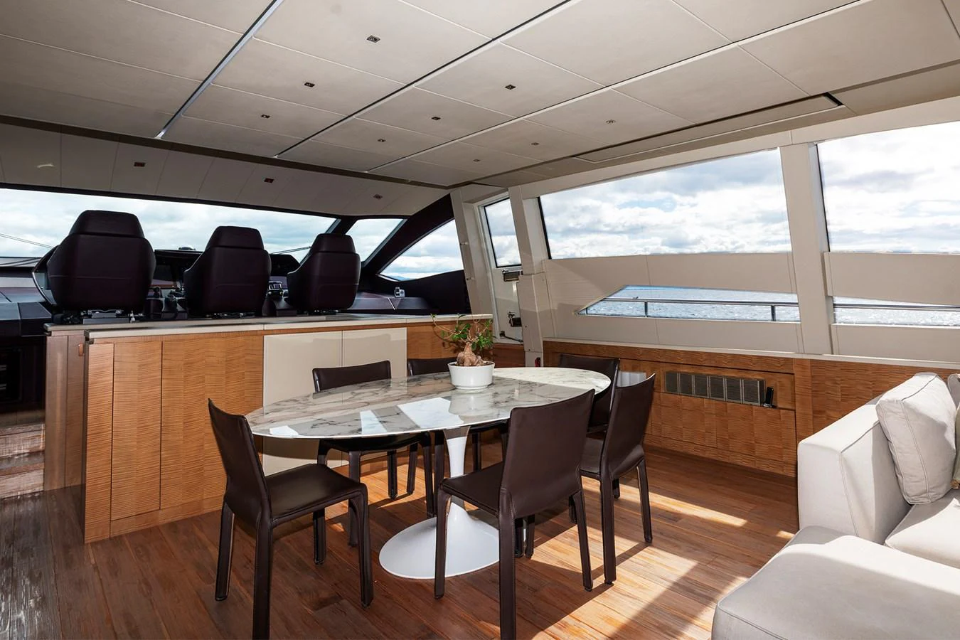a room with a table and chairs aboard GRACE Yacht for Sale