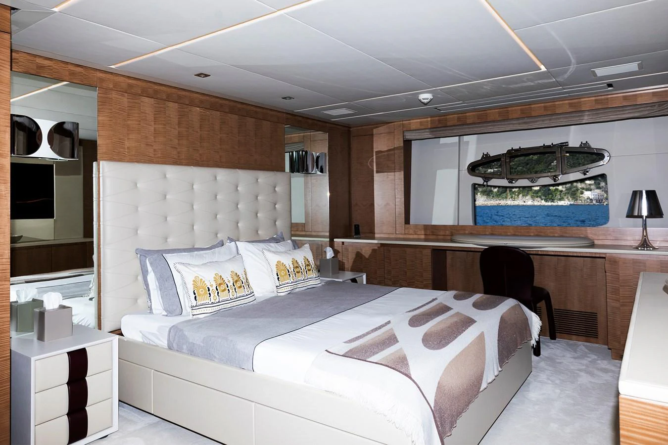a room with a bed and a chair aboard GRACE Yacht for Sale