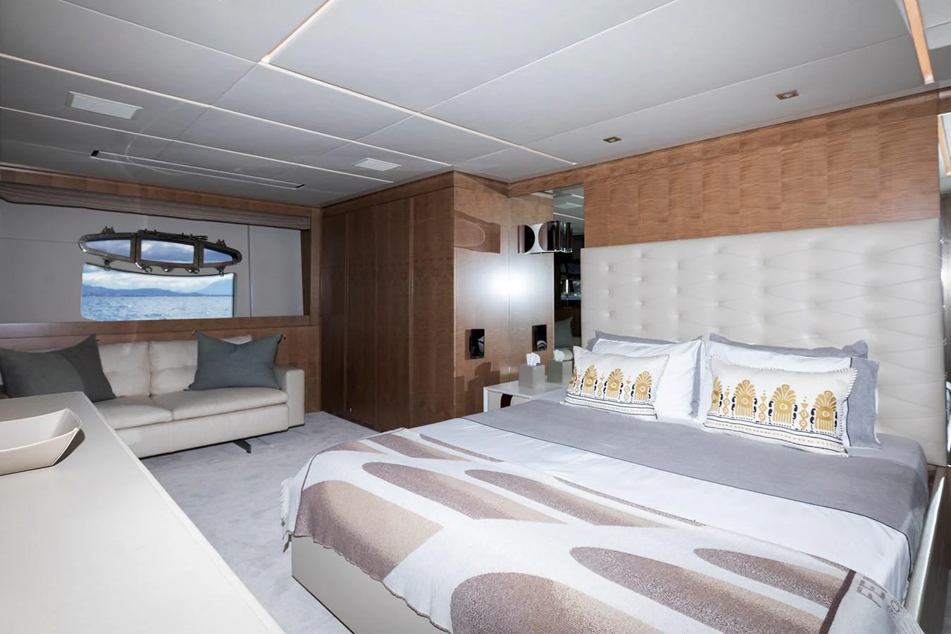 a room with a bed and a couch aboard GRACE Yacht for Sale
