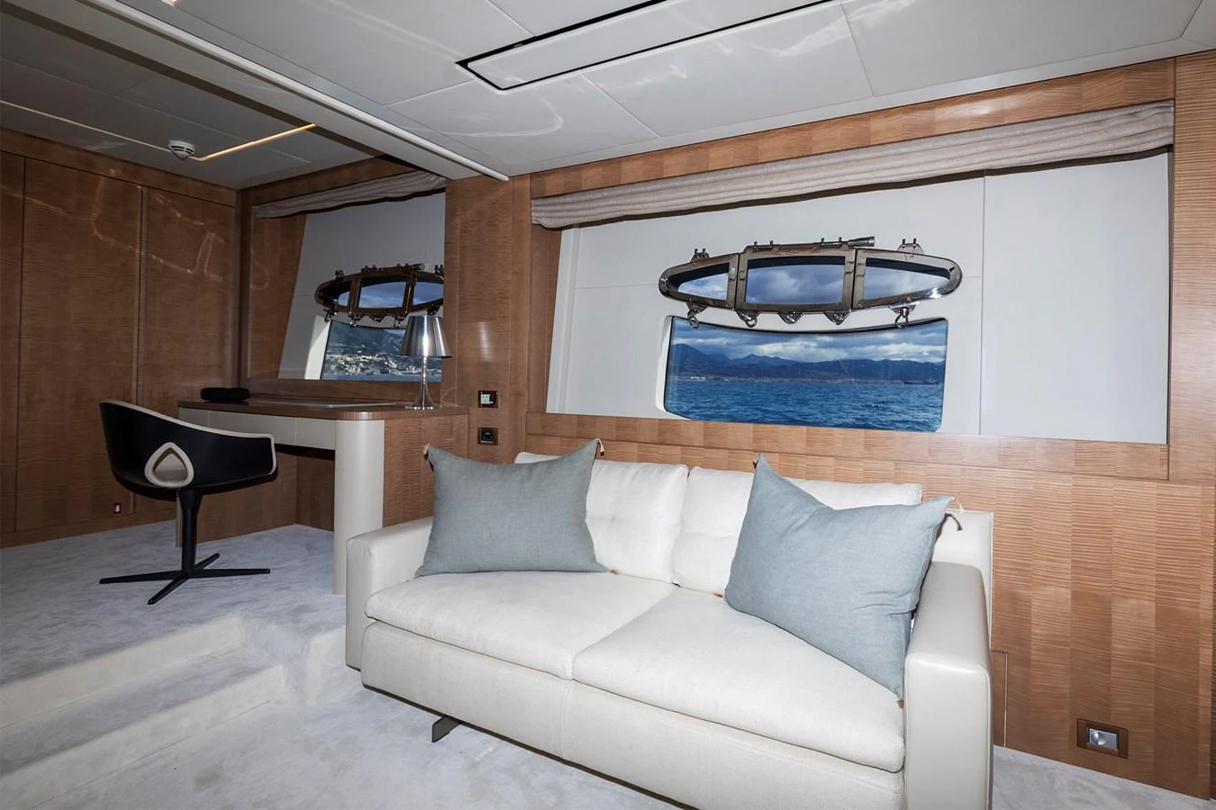 a living room with a couch and a table aboard GRACE Yacht for Sale
