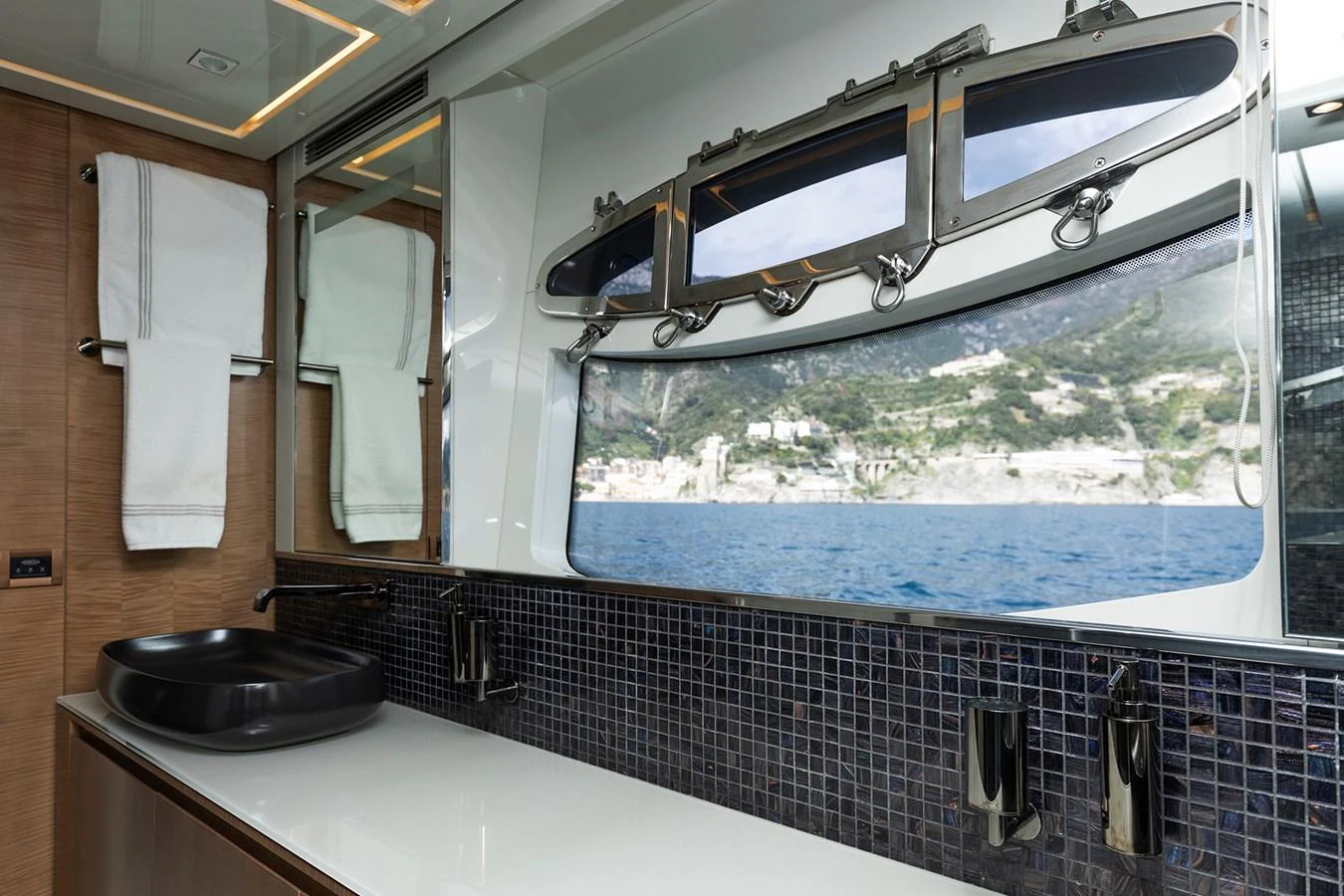 a kitchen with a large window aboard GRACE Yacht for Sale