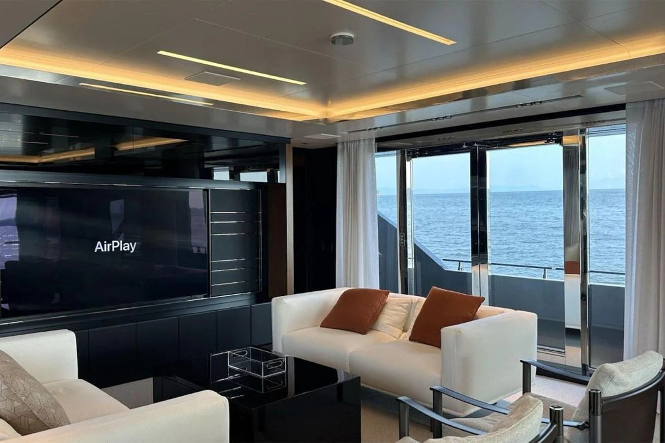 a room with a couch and a tv aboard BELLA DONNA Yacht for Sale