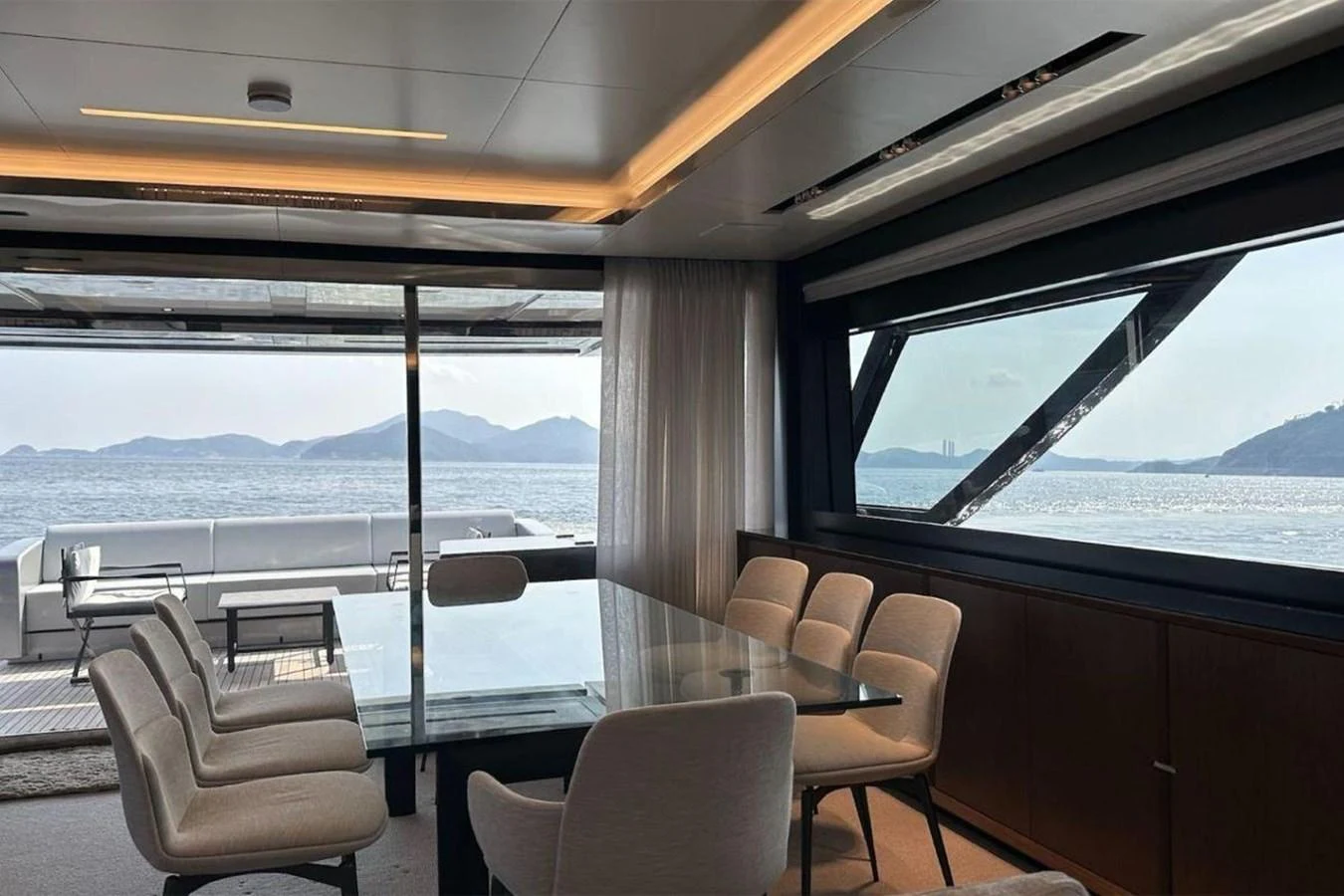 a room with a view of the ocean and mountains aboard BELLA DONNA Yacht for Sale