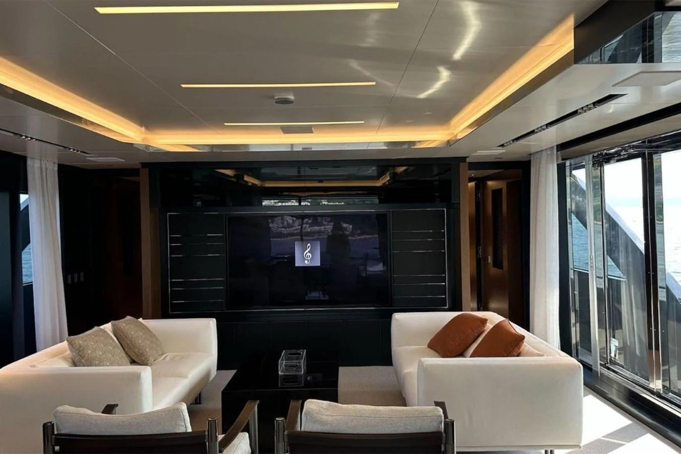 a living room with a large tv aboard BELLA DONNA Yacht for Sale