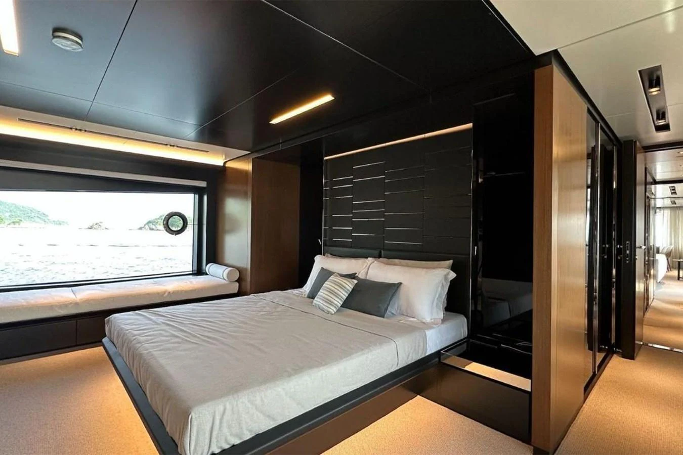 a room with a bed and a window aboard BELLA DONNA Yacht for Sale