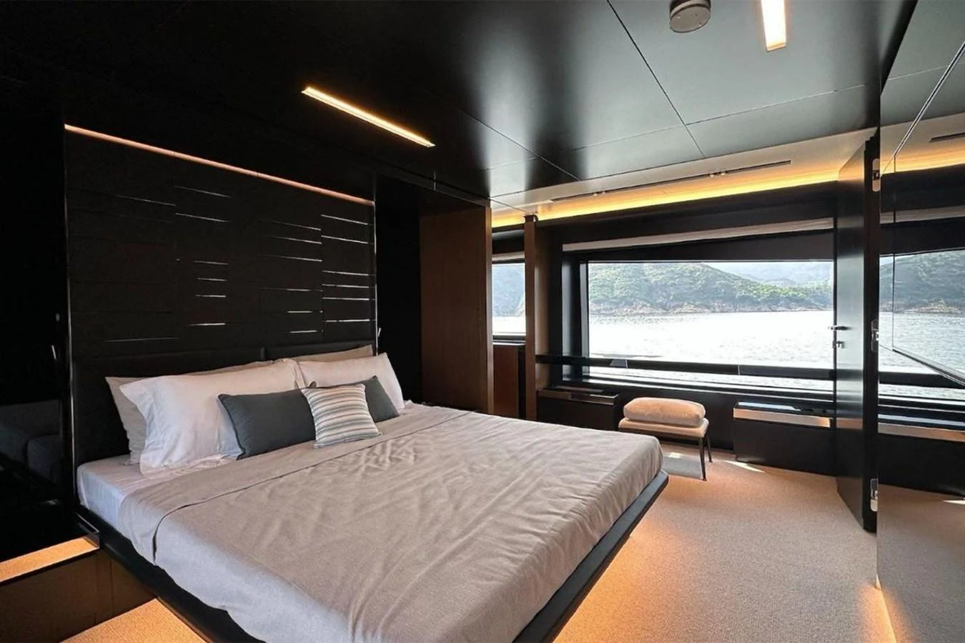 a large bed in a room aboard BELLA DONNA Yacht for Sale