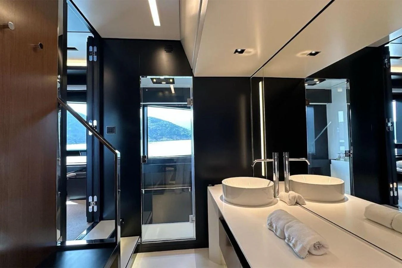 The yacht's bathroom features modern fixtures and a sleek design with ample natural light. aboard BELLA DONNA Yacht for Sale