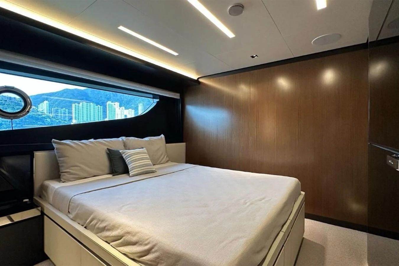 A luxurious stateroom with a large bed and modern lighting. aboard BELLA DONNA Yacht for Sale