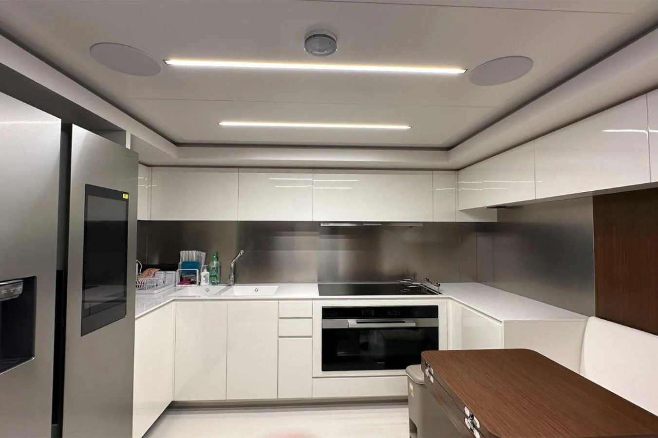 a kitchen with white cabinets aboard BELLA DONNA Yacht for Sale