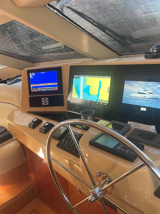 The helm station features advanced navigation equipment and a sleek steering wheel, ensuring precise control and a modern aesthetic. aboard HOPE Yacht for Sale