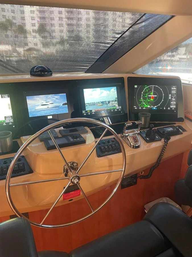 The helm station features advanced navigation equipment and a sleek steering wheel. aboard HOPE Yacht for Sale
