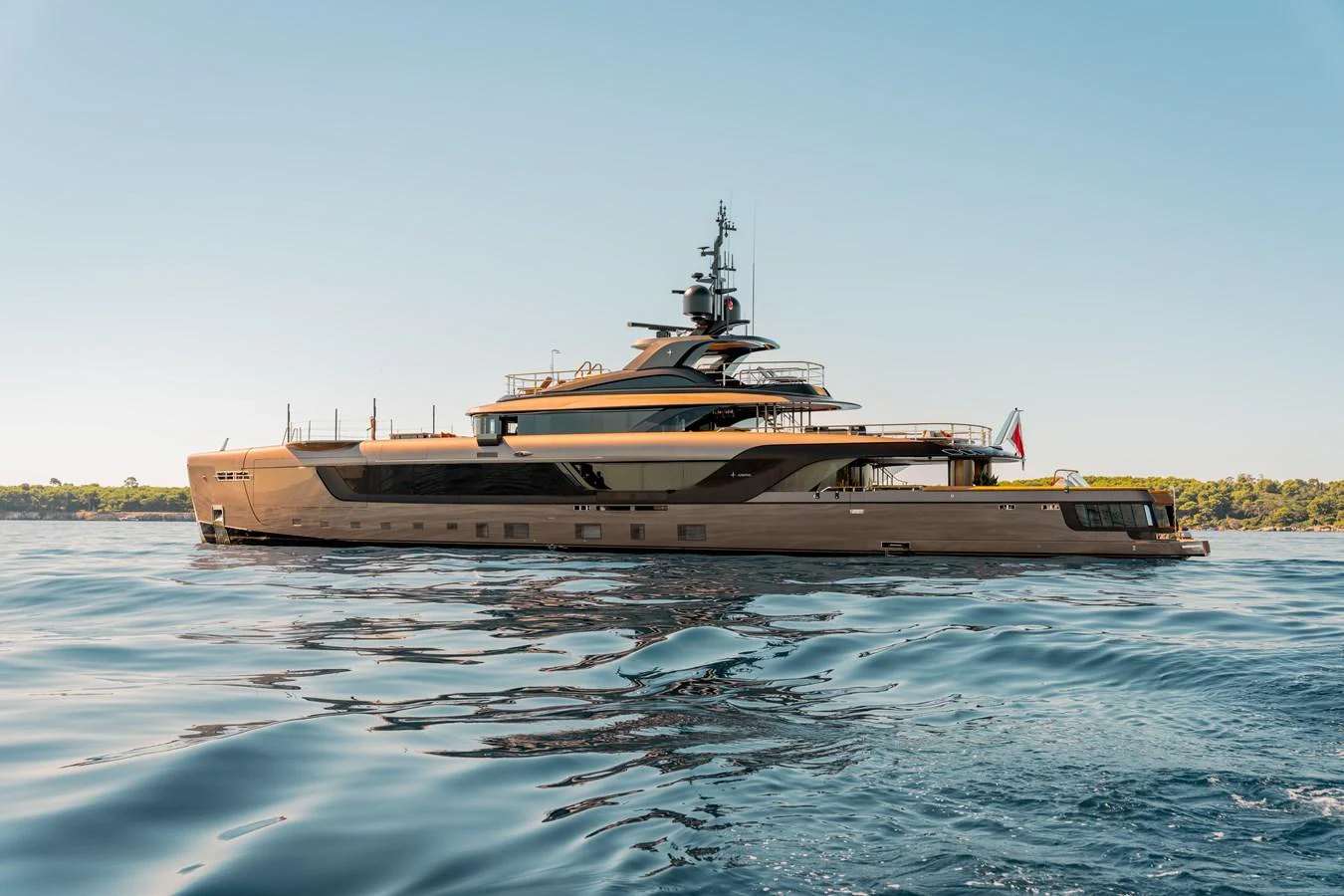 A sleek and modern yacht glides gracefully on calm waters, showcasing its elegant design and luxurious features. aboard RAJA Yacht for Sale
