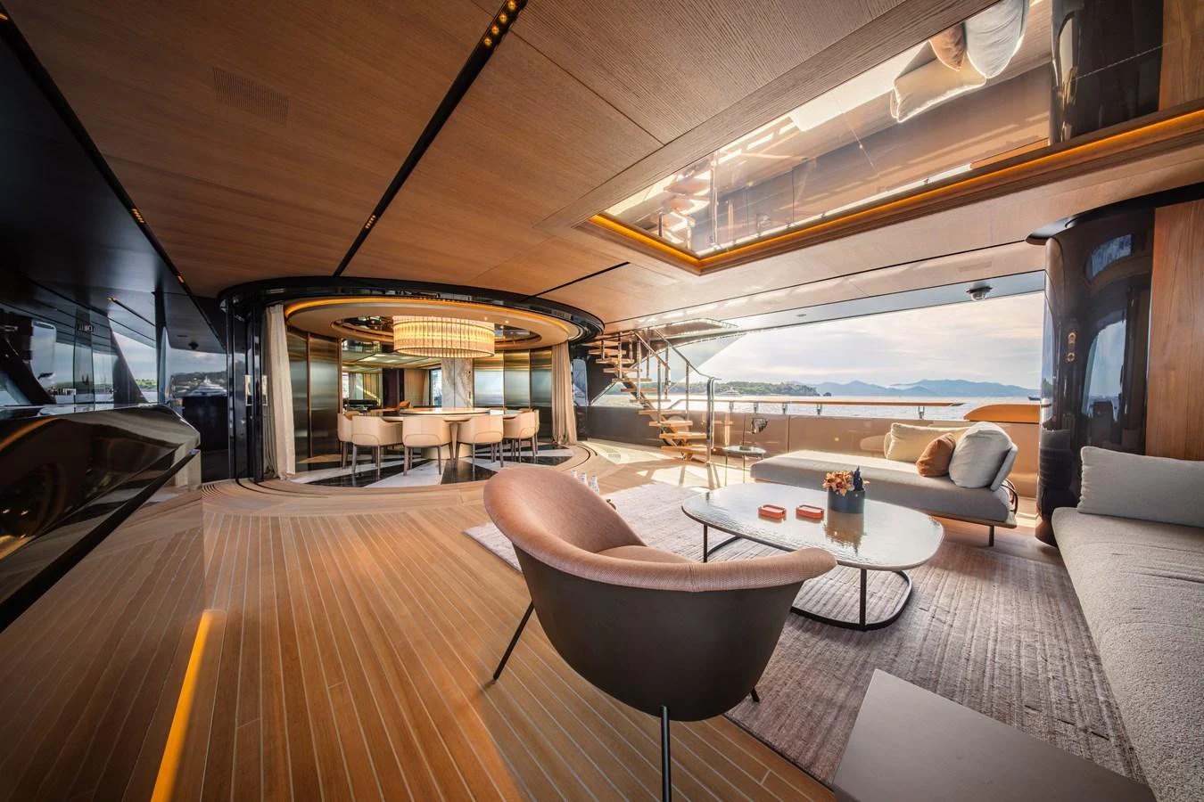 The yacht's salon features elegant seating, a stylish dining area, and panoramic views, creating a luxurious and inviting atmosphere. aboard RAJA Yacht for Sale