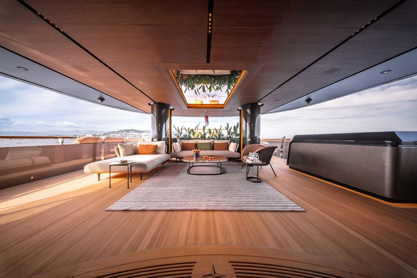 The aft deck offers a luxurious and spacious lounging area with modern furnishings and panoramic views. aboard RAJA Yacht for Sale