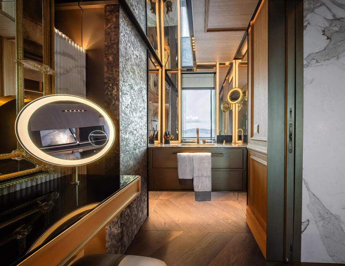 A luxurious bathroom with elegant fixtures and a stunning view through the window. aboard RAJA Yacht for Sale
