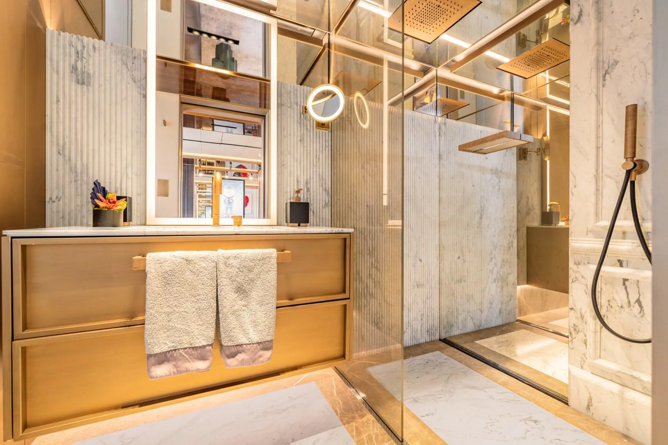 The yacht's bathroom features luxurious marble finishes and modern fixtures. aboard RAJA Yacht for Sale