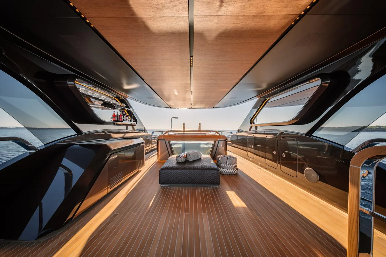 The aft deck offers a luxurious open-air space with sleek design and comfortable seating. aboard RAJA Yacht for Sale