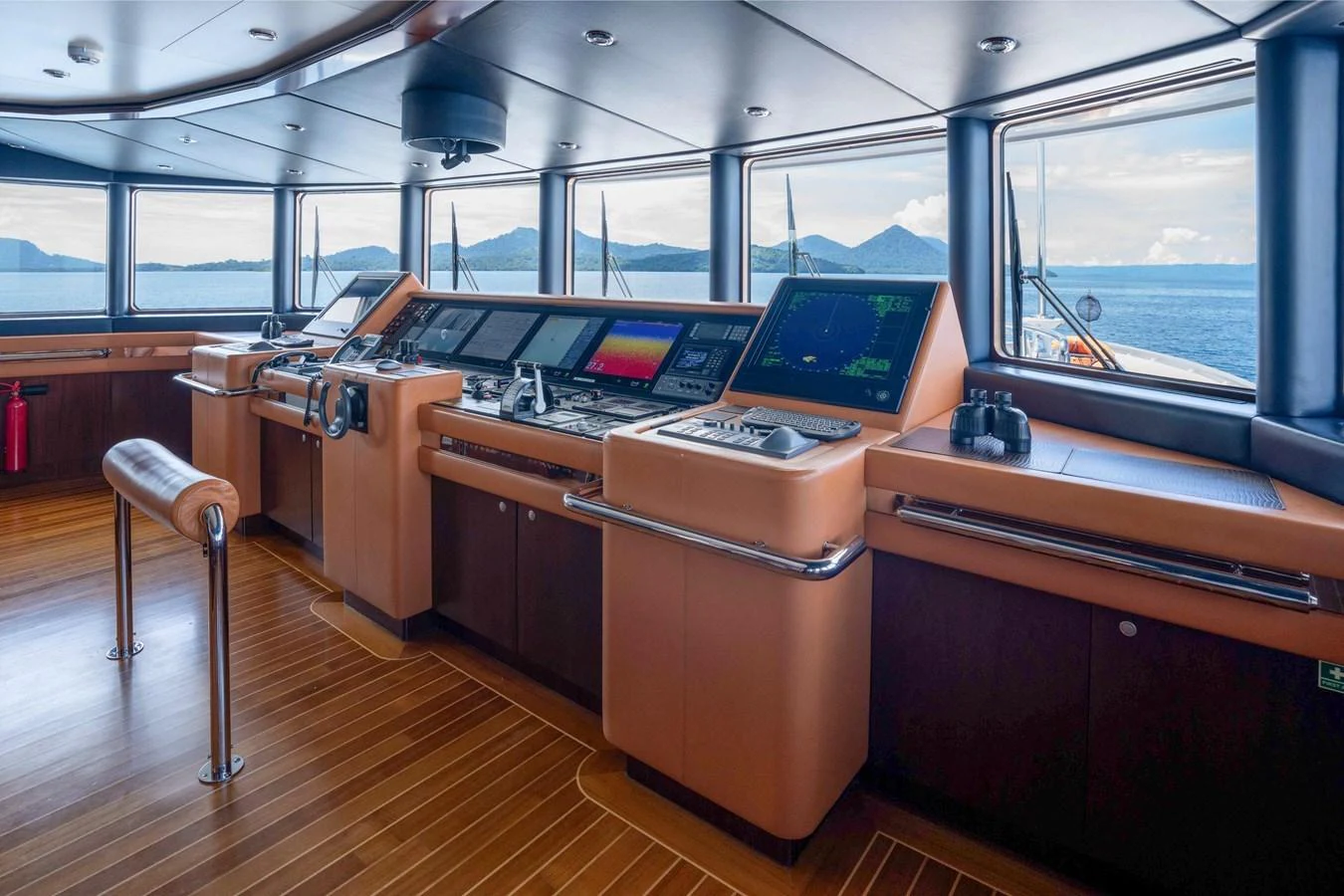 The helm station offers a sophisticated and panoramic view for navigating the yacht. aboard DREAM Yacht for Sale