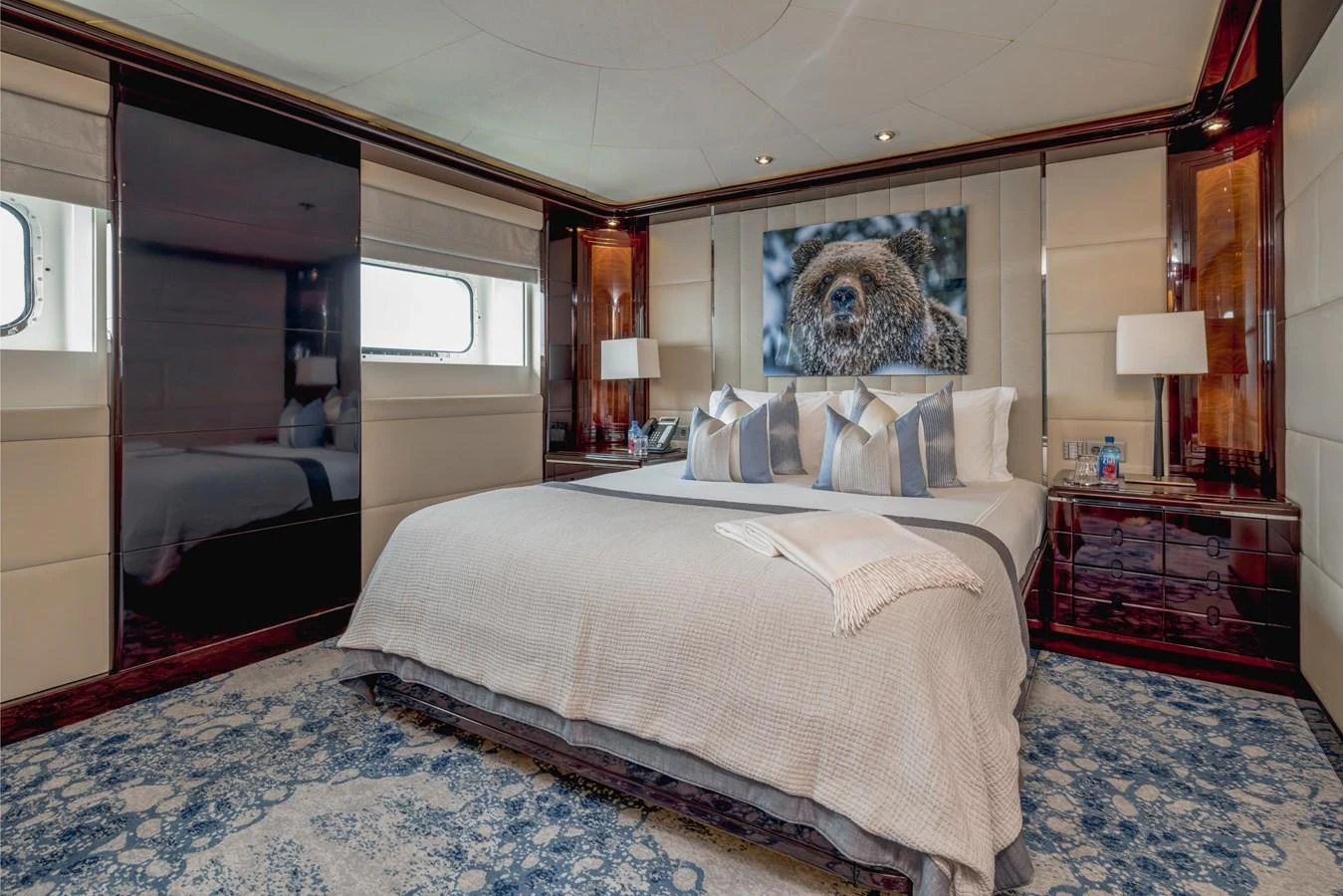 The master stateroom features a luxurious bed with elegant decor and ample natural light. aboard DREAM Yacht for Sale