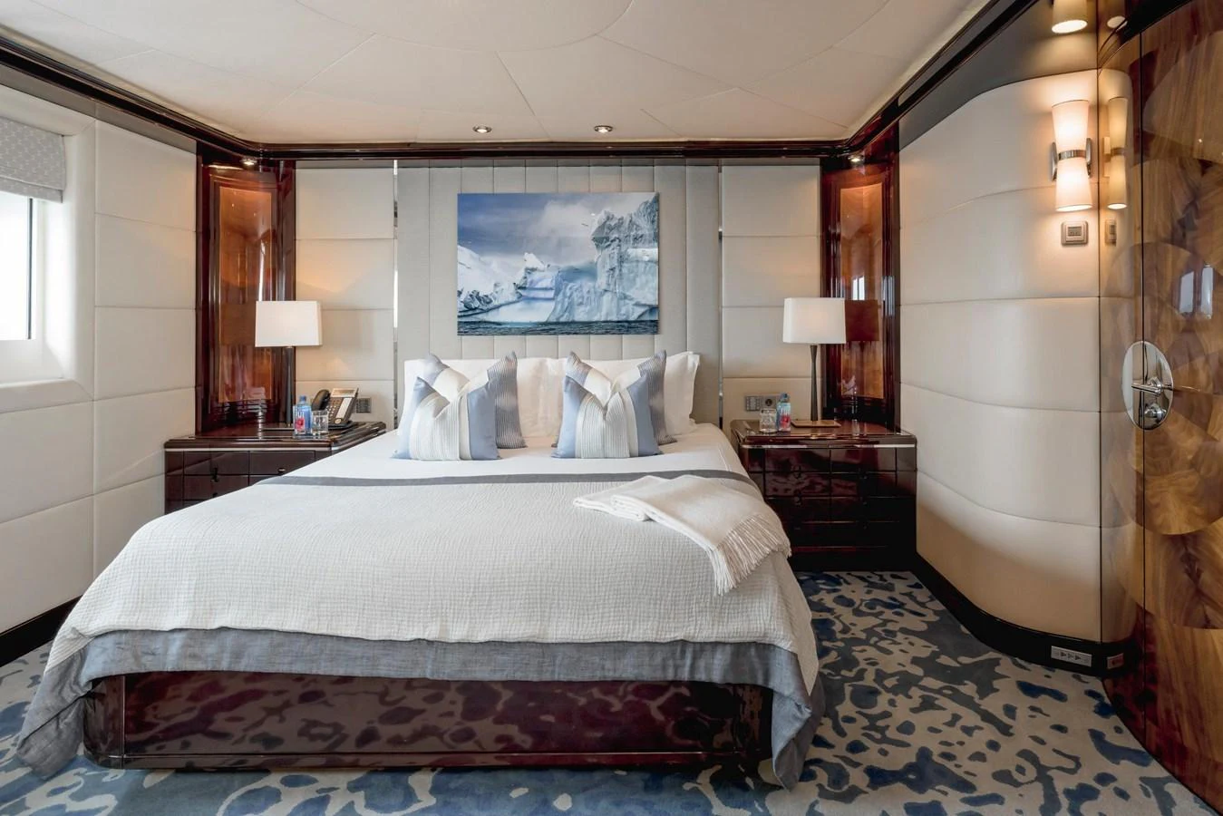 The master stateroom features a luxurious bed with elegant decor and ample natural light. aboard DREAM Yacht for Sale