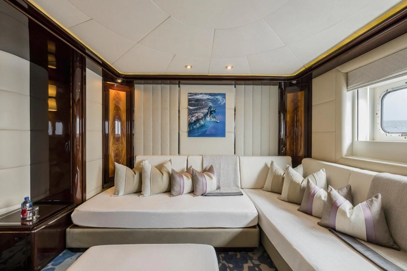 The salon features a luxurious seating area with plush cushions and elegant decor. aboard DREAM Yacht for Sale