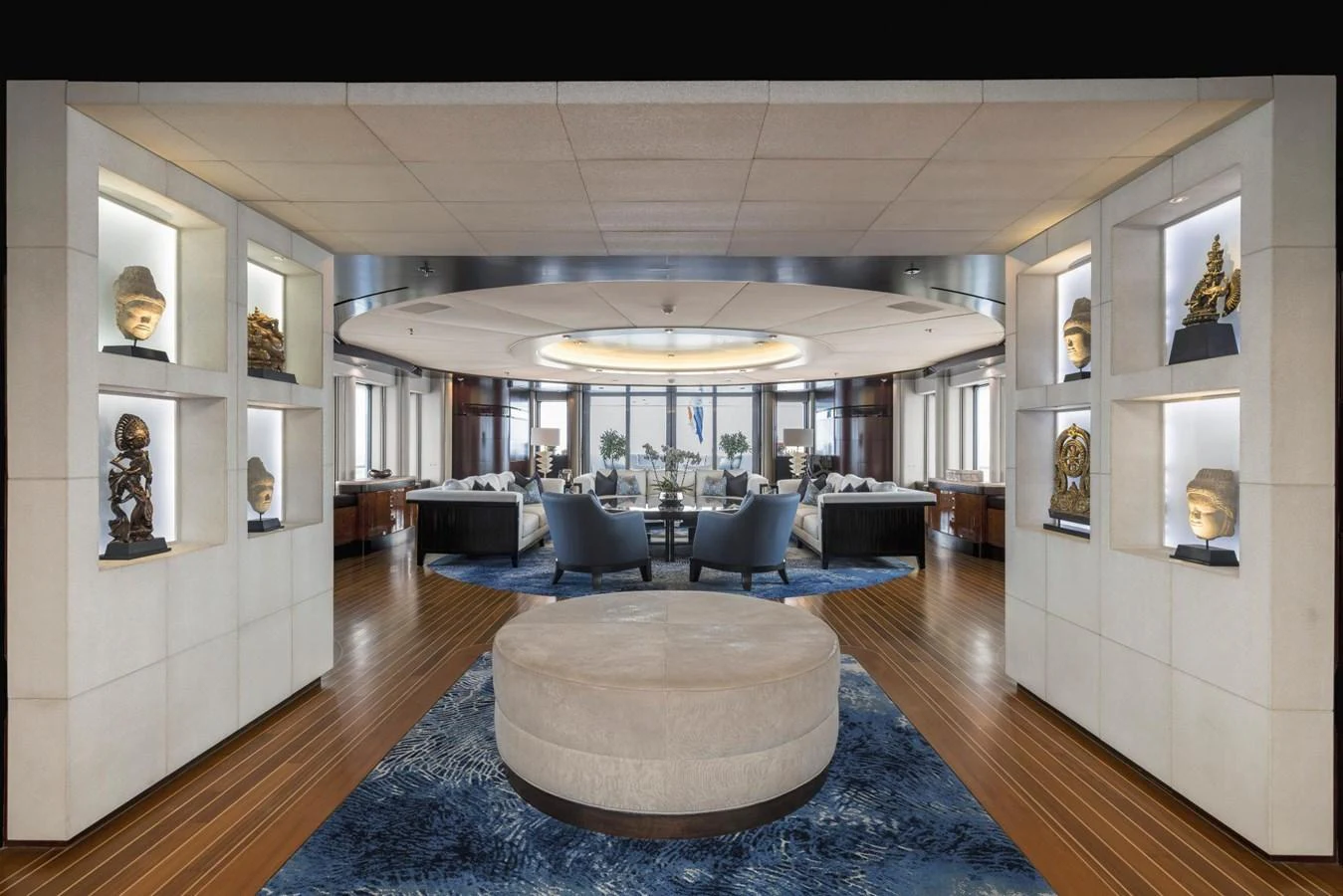The yacht's salon features elegant seating arrangements, artistic decor, and ample natural light. aboard DREAM Yacht for Sale