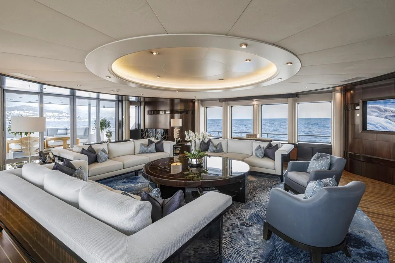 The spacious salon offers panoramic ocean views and luxurious seating arrangements. aboard DREAM Yacht for Sale