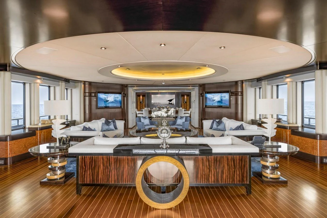 The yacht's salon features luxurious seating, elegant decor, and panoramic windows offering stunning sea views. aboard DREAM Yacht for Sale