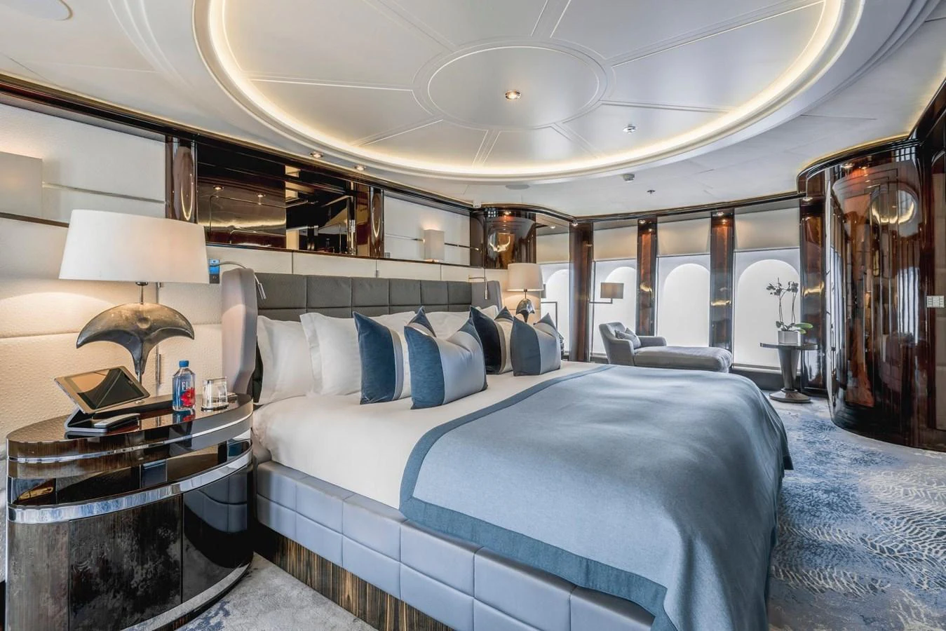 The master stateroom exudes luxury with its spacious layout, elegant furnishings, and sophisticated lighting. aboard DREAM Yacht for Sale