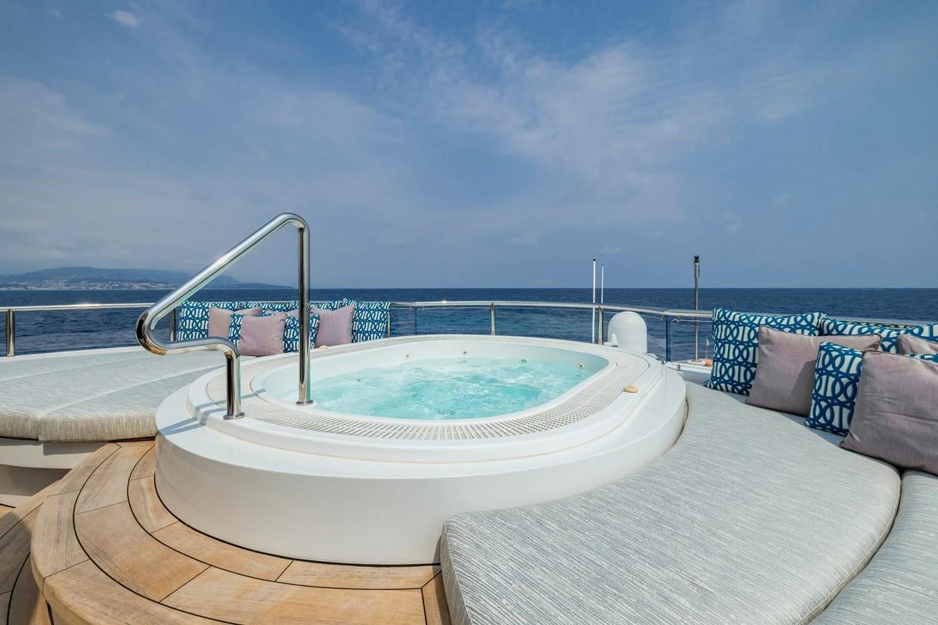 The sundeck features a luxurious jacuzzi surrounded by comfortable seating with ocean views. aboard DREAM Yacht for Sale