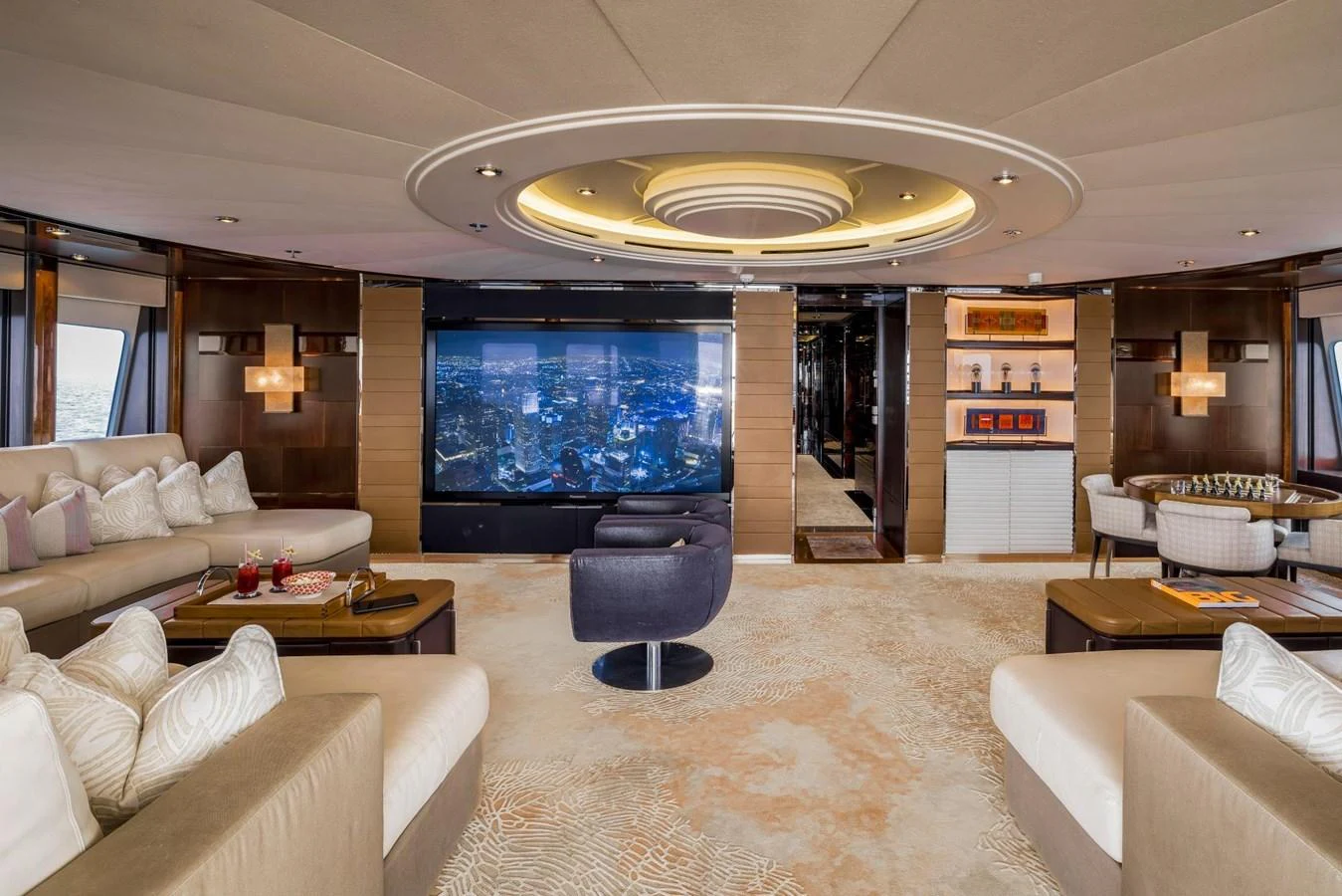 The luxurious salon features plush seating, a large flat-screen TV, and elegant decor. aboard DREAM Yacht for Sale