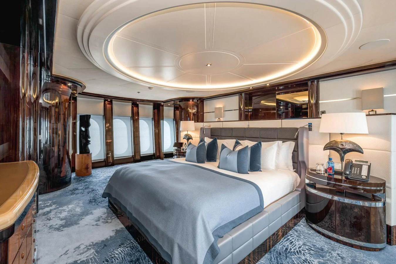 The master stateroom features a luxurious bed with elegant decor and ample natural light. aboard DREAM Yacht for Sale