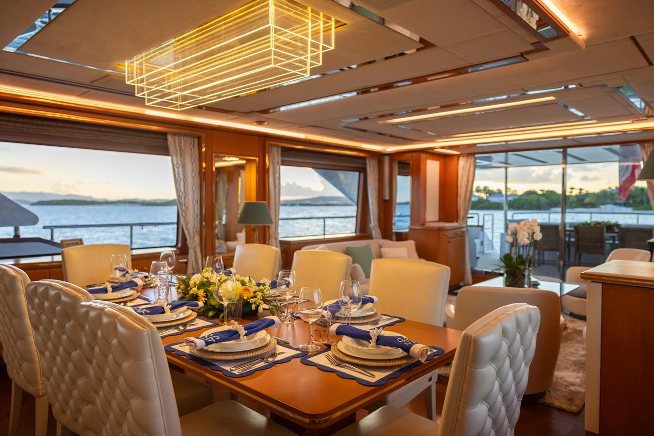 a dining room with a large window aboard SEA GYPSY Yacht for Sale