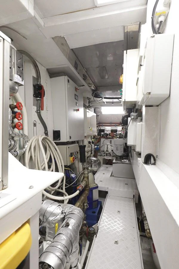 The engine room is meticulously organized with advanced machinery and equipment. aboard SEA GYPSY Yacht for Sale