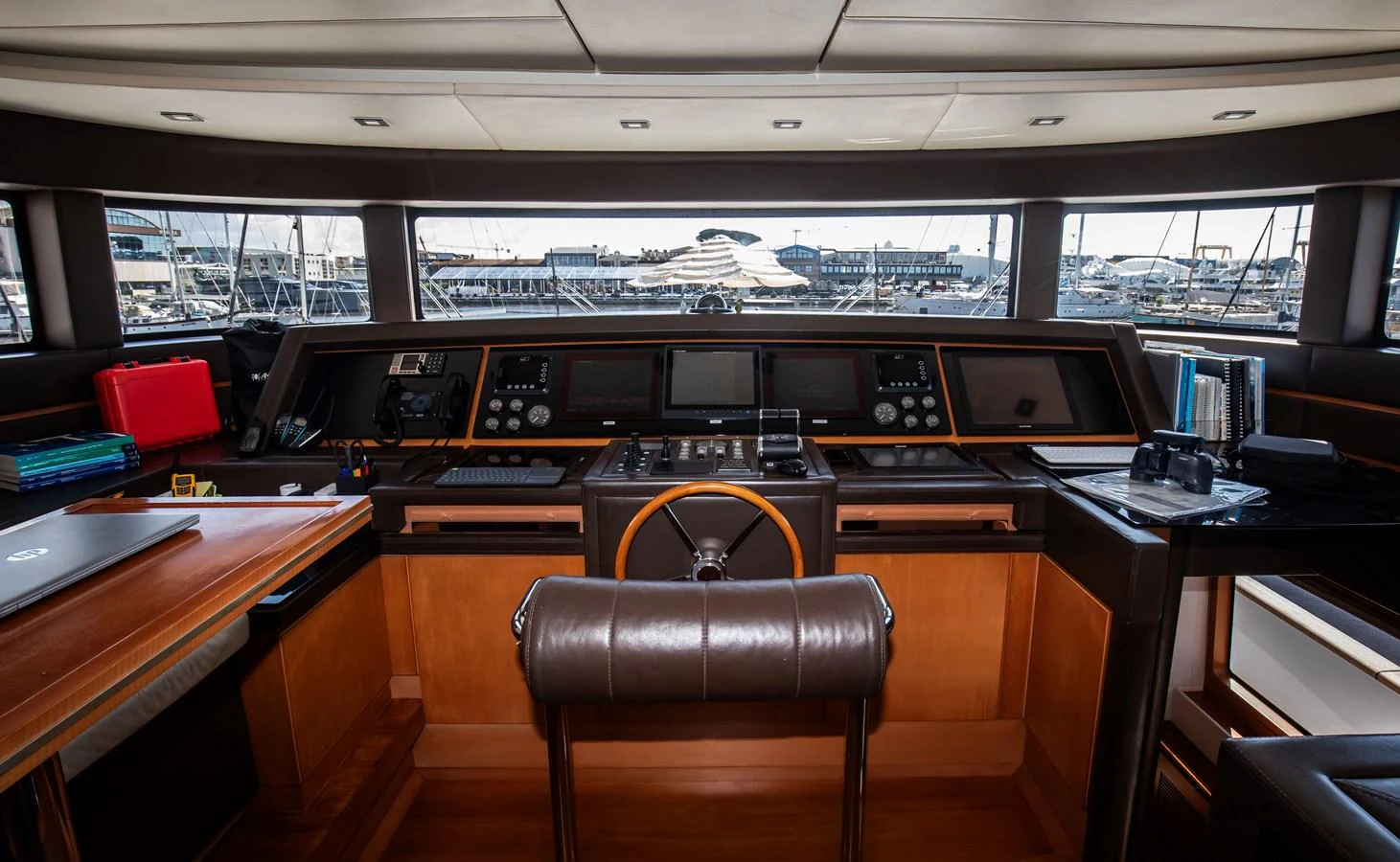 The helm station offers a sophisticated command center with state-of-the-art navigation equipment and a panoramic view. aboard SEA GYPSY Yacht for Sale