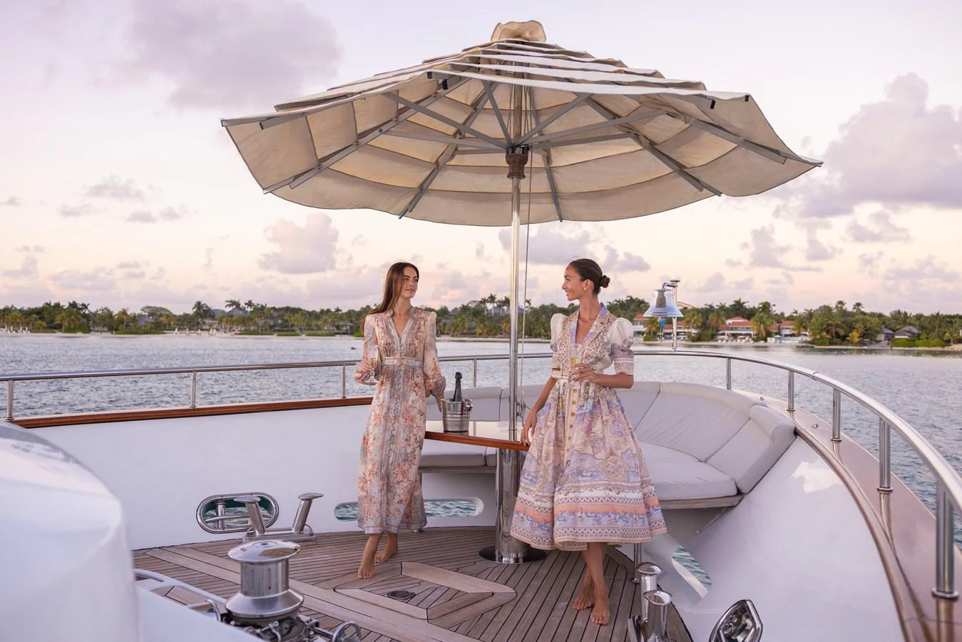 The foredeck offers a serene setting with elegant seating and a large parasol, perfect for enjoying a drink while taking in the scenic views. aboard SEA GYPSY Yacht for Sale